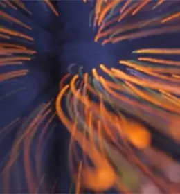 Image of blurred orange lights on a purple background